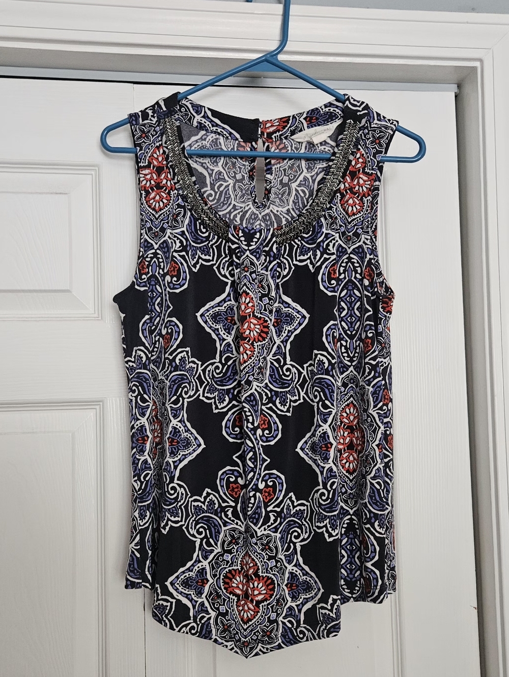 Magnolia Grace sleeveless blouse featuring a paisley pattern and beaded neckline